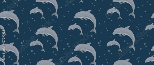 Seamless vector pattern with dolphins to dark blue background for wallpaper, web page background, surface textures.