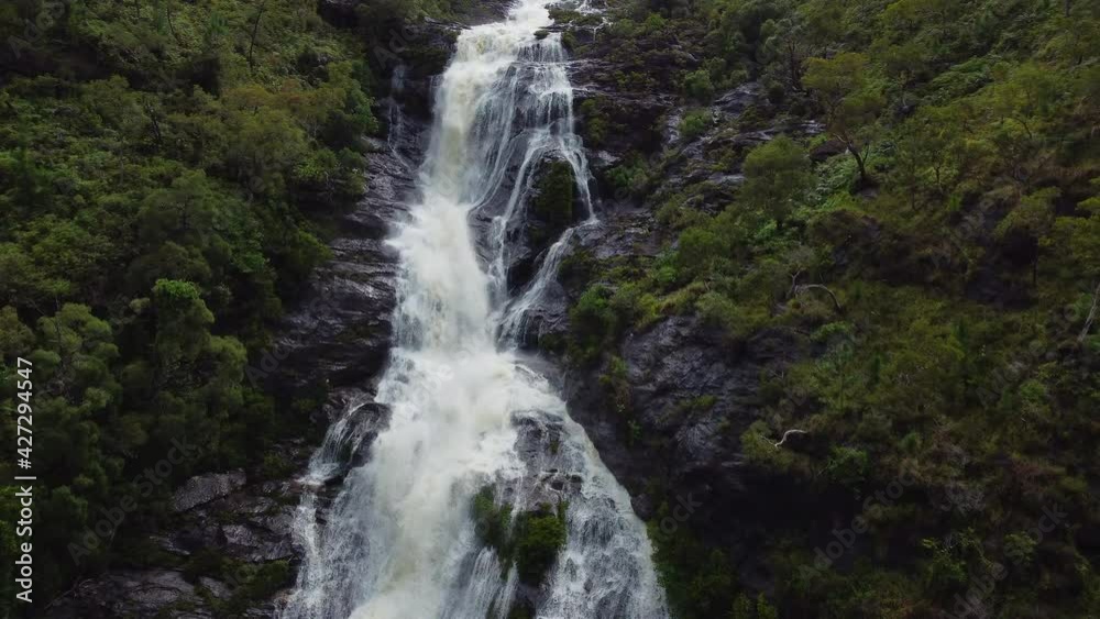 Aerial view approaching huge Colnett waterfall near Hienghene, New Caledonia Aerial view approaching huge Colnett waterfall near Hienghene, New Caledonia