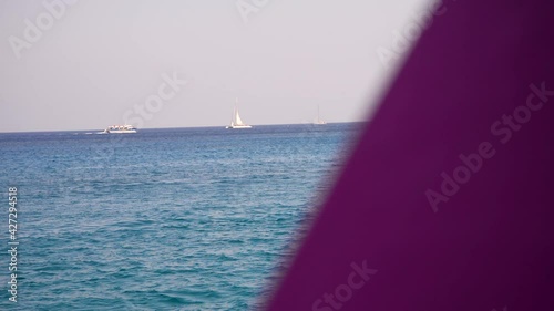 handheld move beautiful ocean shot with boats in Ayia napa Cyprus filmed from boat photo