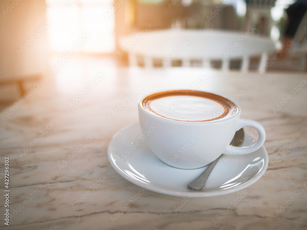 Side top view of hot coffee Cappuccino, espresso in the white cup put on the marble table in cafe morning work day background. Side top view of hot coffee Cappuccino, espresso in the white cup put on the marble table in cafe morning work day background.