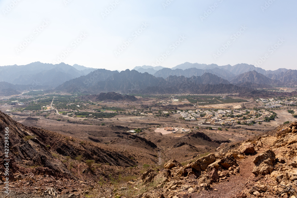 Rocky and dry landscape of Hatta town from above, seen from Hajar Mountains, United Arab Emirates.