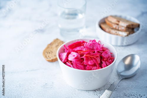 Fresh raw pickled beet cabbage with casrrot in a bowl