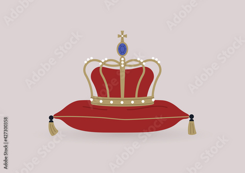 A golden crown decorated with gems sitting on a silk pillow with golden tassels