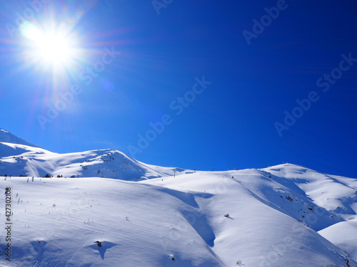 Snowy mountain in a sunny day photo