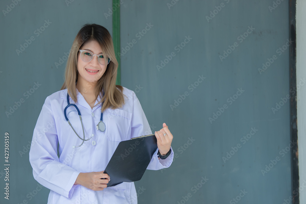 Portrait of young asian doctor wear glasses in a hospital,Thailand people Portrait of young asian doctor wear glasses in a hospital,Thailand people