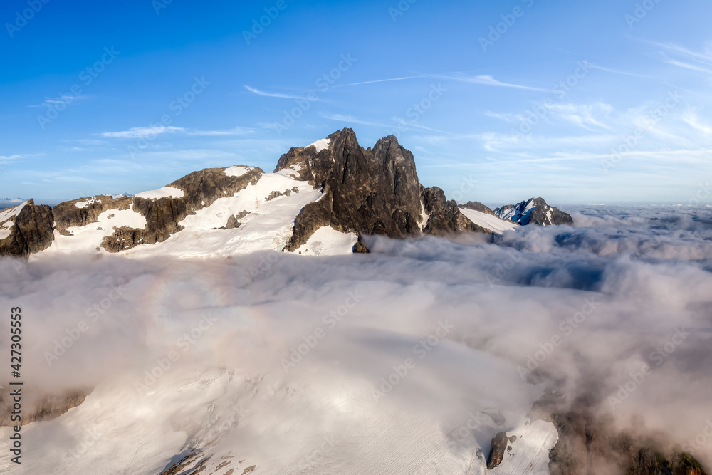 custom made wallpaper toronto digitalAerial View from Airplane of Tantalus Range covered in clouds. Blue Sky Art Render. Taken near Squamish, North of Vancouver, British Columbia, Canada. Canadian Nature Background
