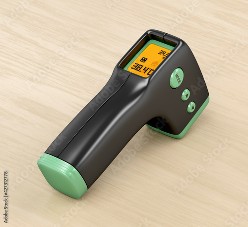 Infrared thermometer on wood table