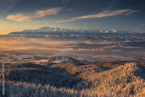 Winter morning in Gorce on the tower on the top of Lubań. A beautiful, romantic atmosphere with a view of the Pieniny Mountains, the Beskids and the Tatra Mountains. 