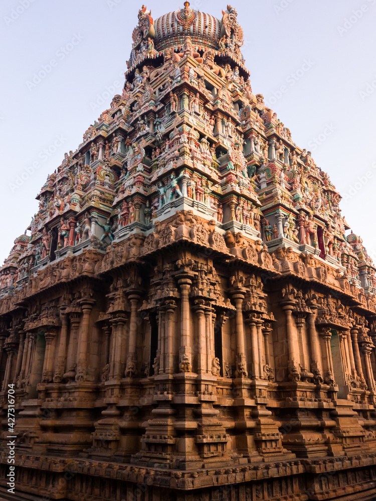 An ornately carved tower spire of the ancient Hindu temple complex of Meenakashi Amman in the city of Madurai.