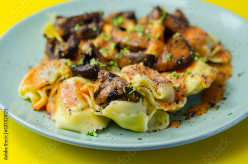 Fresh egg pasta with ricotta cheese and porcini mushrooms paste filling, delicious tortelloni