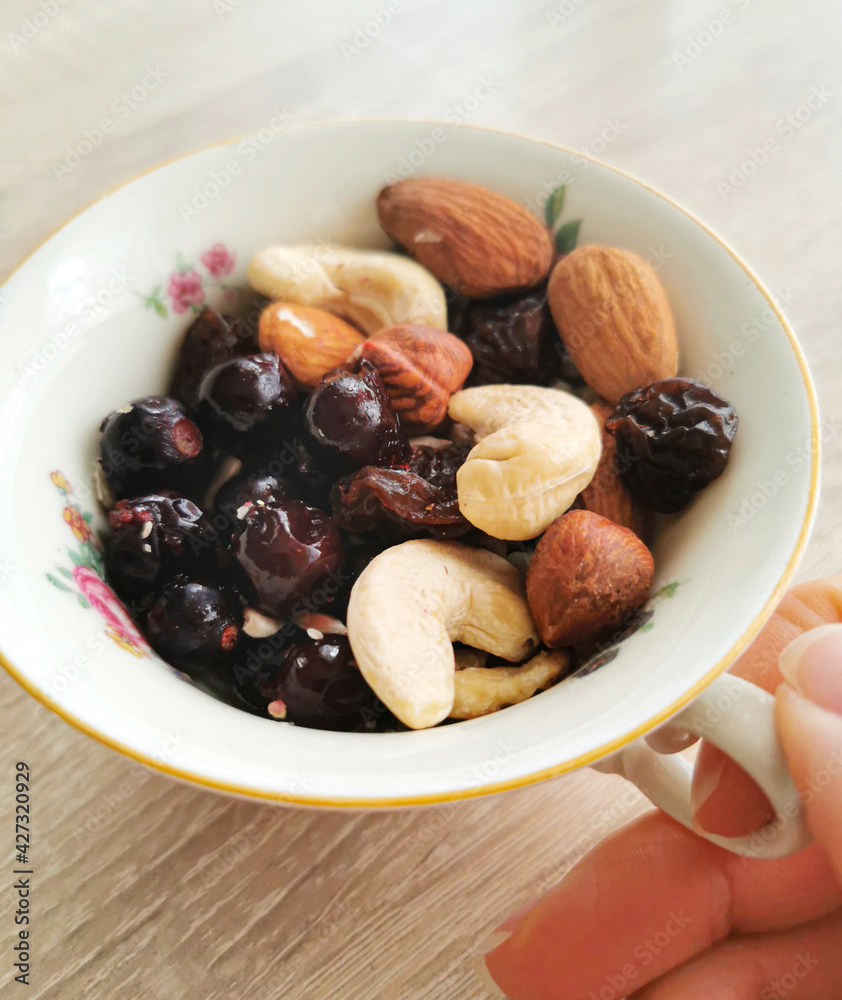 Group of mixed nuts and berries. Cashews, almonds, hazelnuts, black currants. Healthy food and snack Group of mixed nuts and berries. Cashews, almonds, hazelnuts, black currants. Healthy food and snack