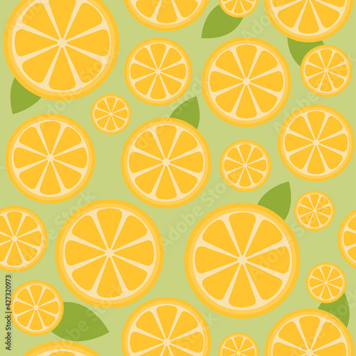 Green and yellow seamless pattern with lemon slice and leaves. Fresh fruit illustration for background, wallpaper, textile or fabric