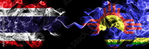 Thailand, Thai vs United States of America, America, US, USA, American, Roswell, New Mexico smoky mystic flags placed side by side. Thick colored silky abstract smokes flags.