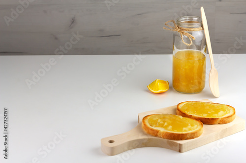 Bright yellow lemon jam and sandwiches with it