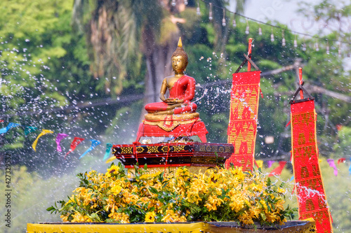 Fotografija The tradition of bathing the Buddha on an annual basis Chiang mai Songkran festival, Thailand