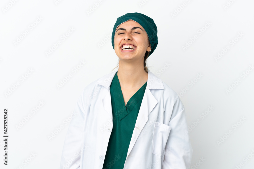 Surgeon caucasian woman isolated on white background laughing Surgeon caucasian woman isolated on white background laughing