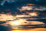 Dramatic sunset cloudy sky with blue clouds as abstract beautiful cloudscape background.