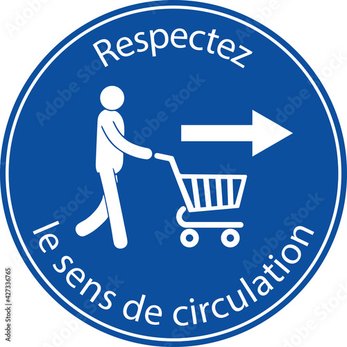 affiche pour respecter le sens de circulation en blanc représenté par une personne tenant un caddie en blanc avec une flèche blanche pour allez sur sa droite dans un rond bleu