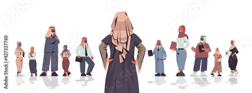 rear view businesswoman standing in front of arabic businesspeople team leader leadership concept
