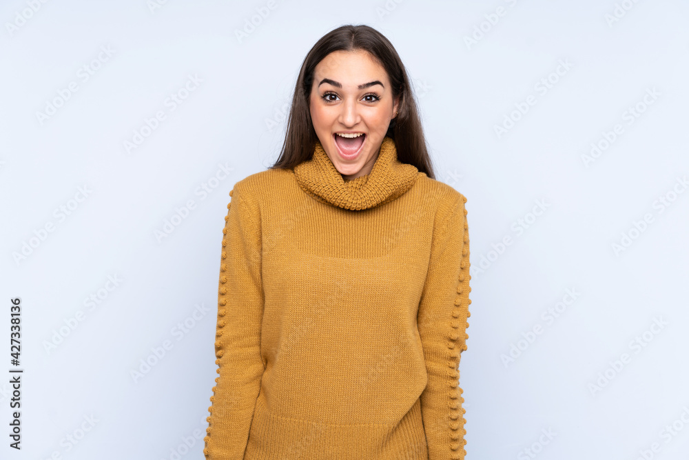 Fototapeta premium Young caucasian woman isolated on blue background with surprise facial expression