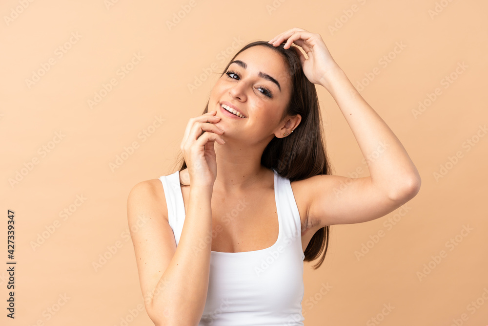 Young caucasian woman isolated on beige background . Portrait Young caucasian woman isolated on beige background . Portrait
