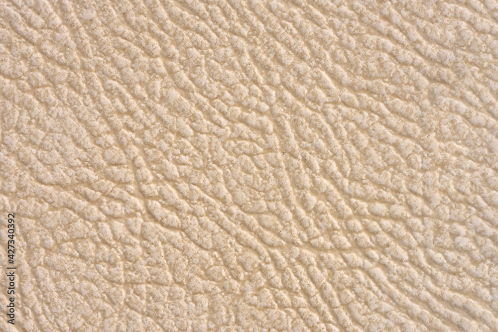 Ceramic tile beige leather effect background. Closeup texture