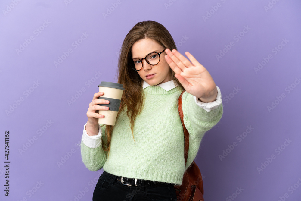 Teenager student girl over isolated purple background making stop gesture and disappointed Teenager student girl over isolated purple background making stop gesture and disappointed