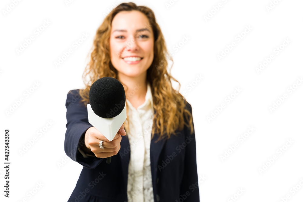 Hispanic woman smiling while doing a news interview Hispanic woman smiling while doing a news interview