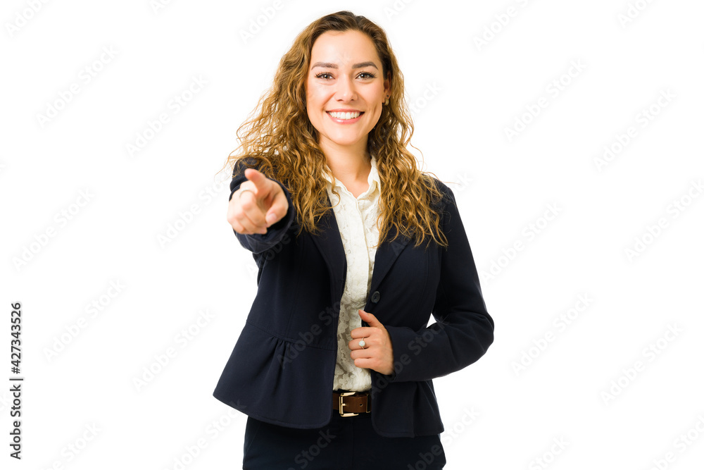 Excited beautiful woman pointing her finger to you Excited beautiful woman pointing her finger to you