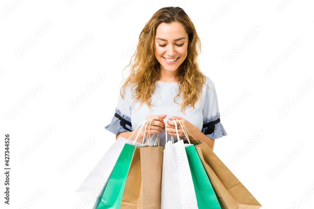 Happy attractive woman feeling excited while shopping