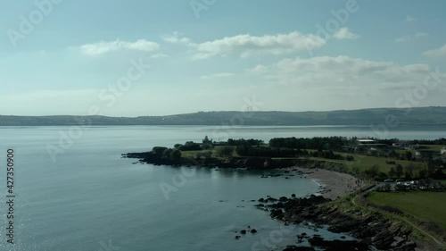 Wallpaper Mural Aerial dolly in of sea coast at day, lighthouse in background Torontodigital.ca