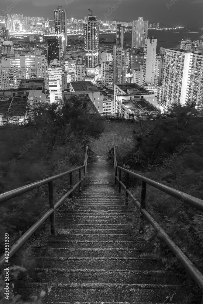 Night scene of downward stairway to downtown of Hong Kong city
