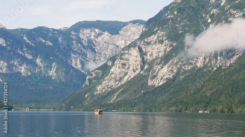 Wallpaper Mural Slow motion landscape still shot of boat on Lake Bohinj with Slovenia Mountains Triglav National Park Valley Ljubljana Europe 1920x1080 HD Torontodigital.ca