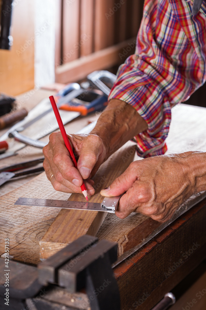 Carpenter working on the work bench, joinery tools and woodwork Carpenter working on the work bench, joinery tools and woodwork