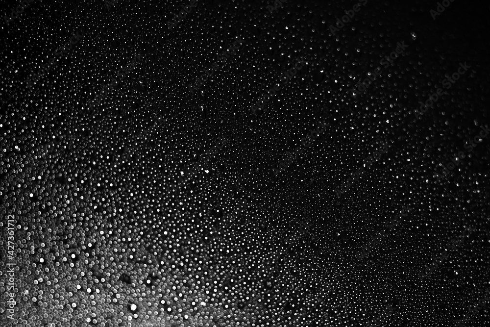 Obraz premium black white background from drops of water and ice. defocus. . High quality photo