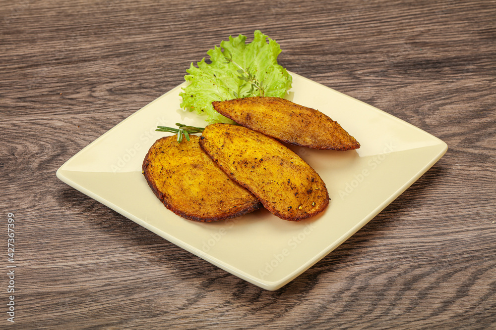 Baked potato with herbs and spices Baked potato with herbs and spices