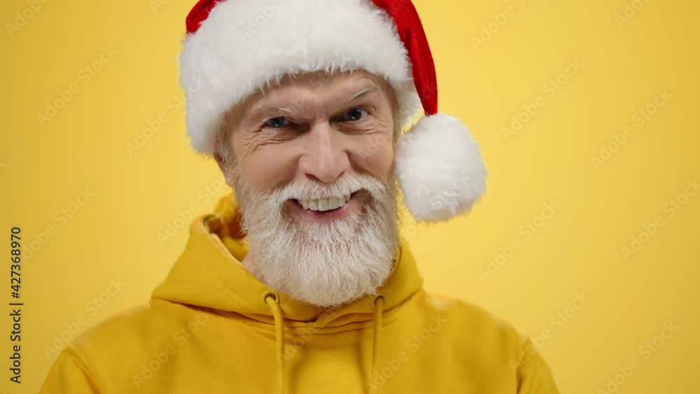 Stylish old man gesticulating in studio. Happy guy looking camera indoors. Stylish old man gesticulating in studio. Happy guy looking camera indoors.