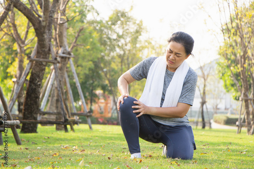 Old Asian people suffer from exercise pain. old woman suffering from a sore knee.