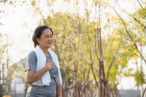 Old Asian people suffer from exercise pain. Senior woman having heart attack