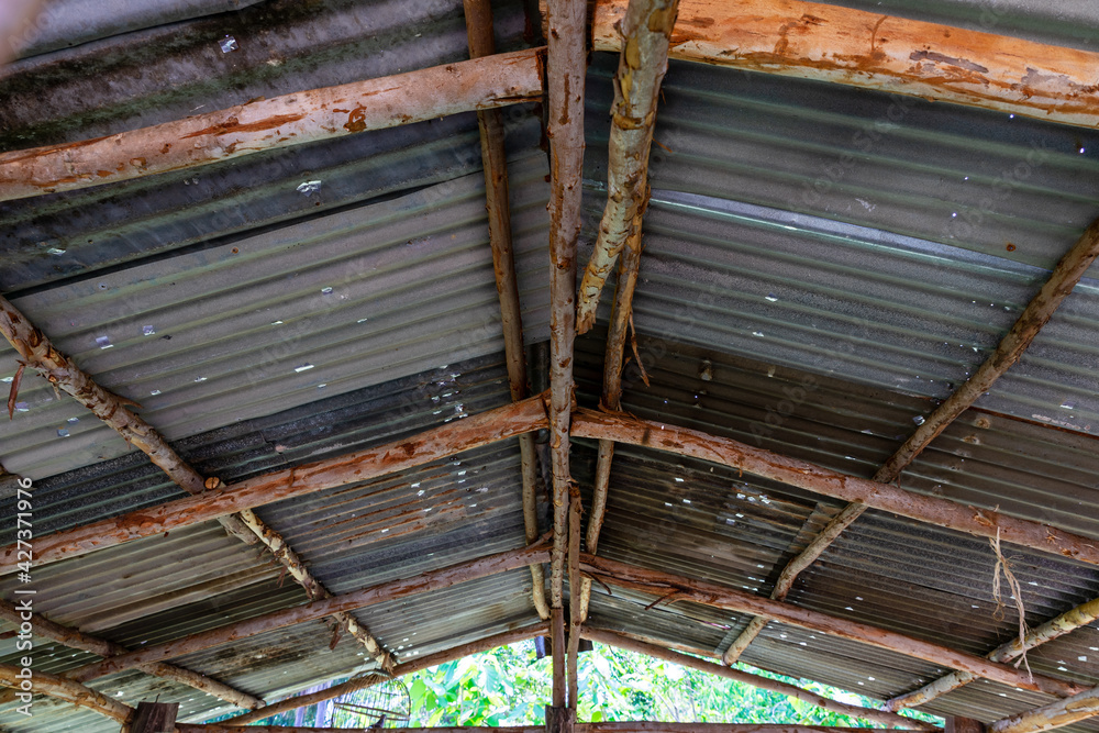 Steel roof structure. Moonlight bulb. Steel structure with roof tiles. Architectural structure of roof. Large roof layout used for industrial plants. Steel roof structure. Moonlight bulb. Steel structure with roof tiles. Architectural structure of roof. Large roof layout used for industrial plants.