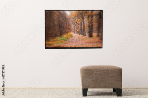 Modern TV set hanging on wa...