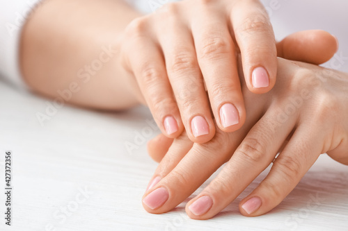 Beautiful female hands on light background