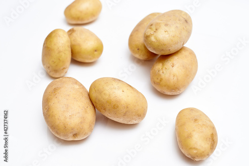 fresh washed potatoes on white background