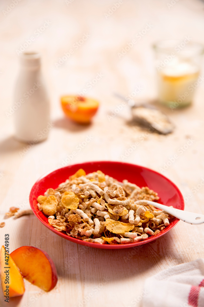 Breakfast cereal, in red bowl Breakfast cereal, in red bowl