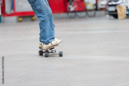 Young people playing skateboarding outdoor. Sports Concept