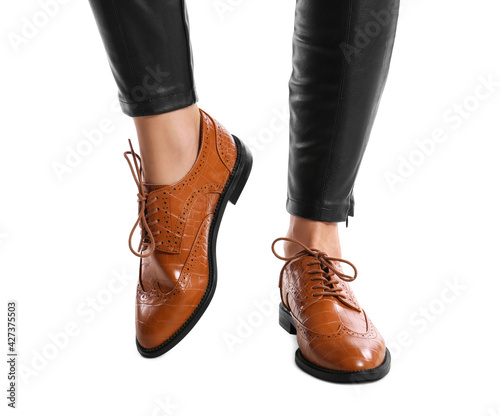 Woman in stylish shoes on white background  closeup