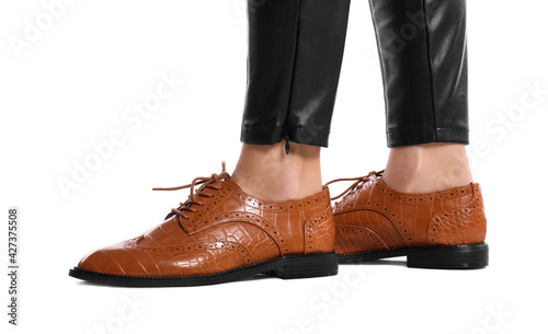 Woman in stylish shoes on white background, closeup