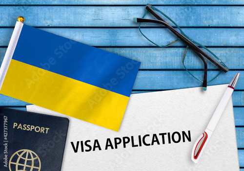 Visa application form and flag of Ukraine