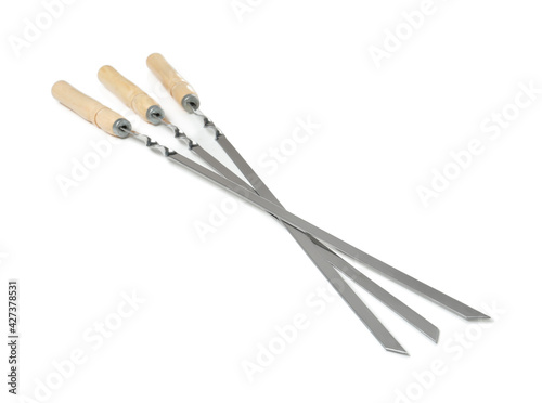 Metal skewers with wooden handle on white background
