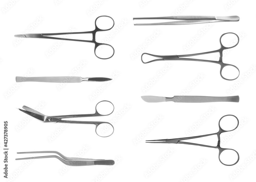 Set with different surgical instruments on white background Set with different surgical instruments on white background